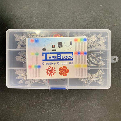 A translucent plastic box which has a label TapeBlock Creative Circuit Kit. It has  LED in multiple compartments