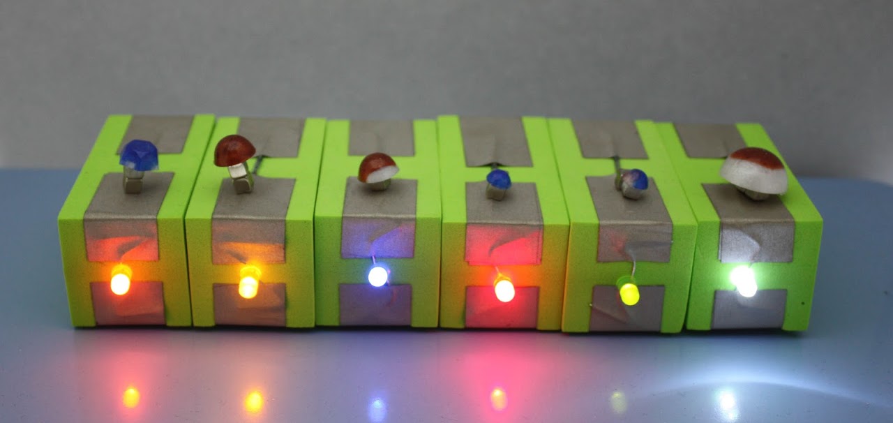 6 Integrated TapeBlocks with reed (magnetic) switches on the top and colored light along the front.