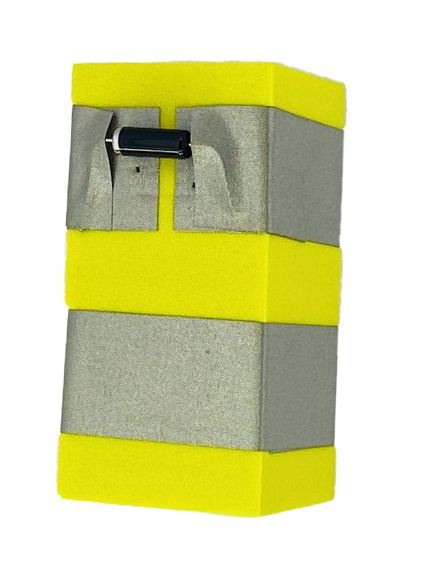 A yellow foam block with two parallel rows of conductive tape wrapped around it. The top layer of tape has a gap in it and in the gap is a black tilt switch. 