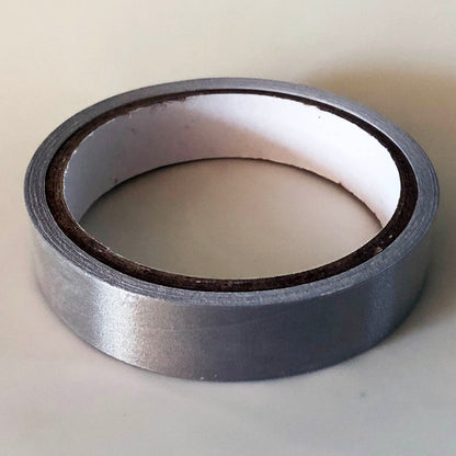 A 5 meter roll of conductive tape, The core of the roll is 7cm and the tape is 2cm wide. The roll is closed